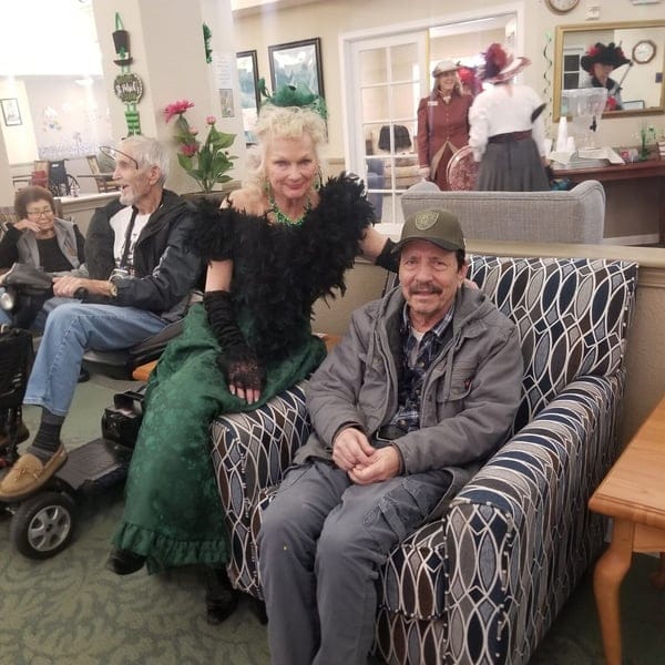 Residents enjoying time in a common area with festive attire