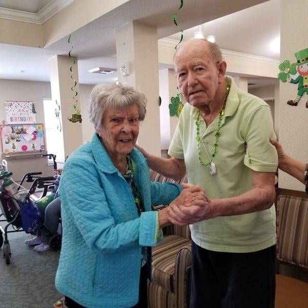 Two residents celebrating with decorations