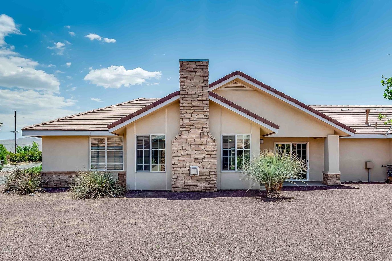 Exterior view of a senior living facility with landscaping