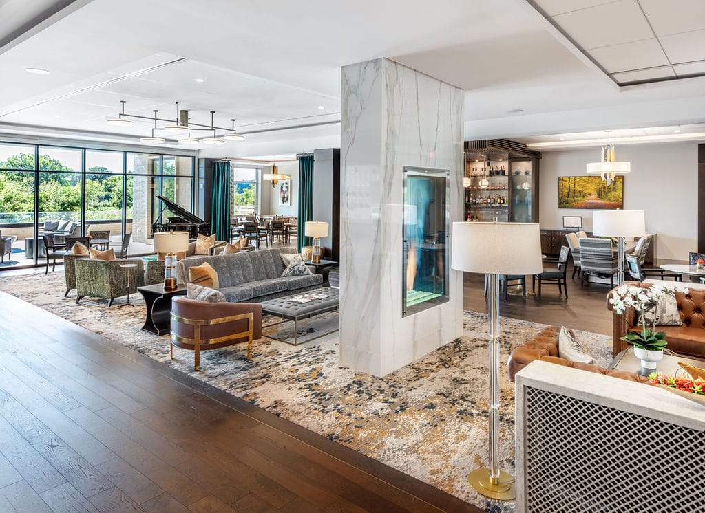 Bright common area with seating and piano