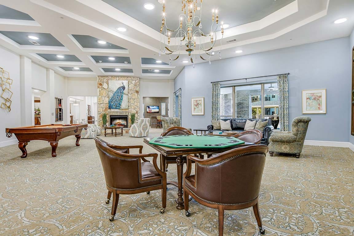 Interior common area with seating and a game table