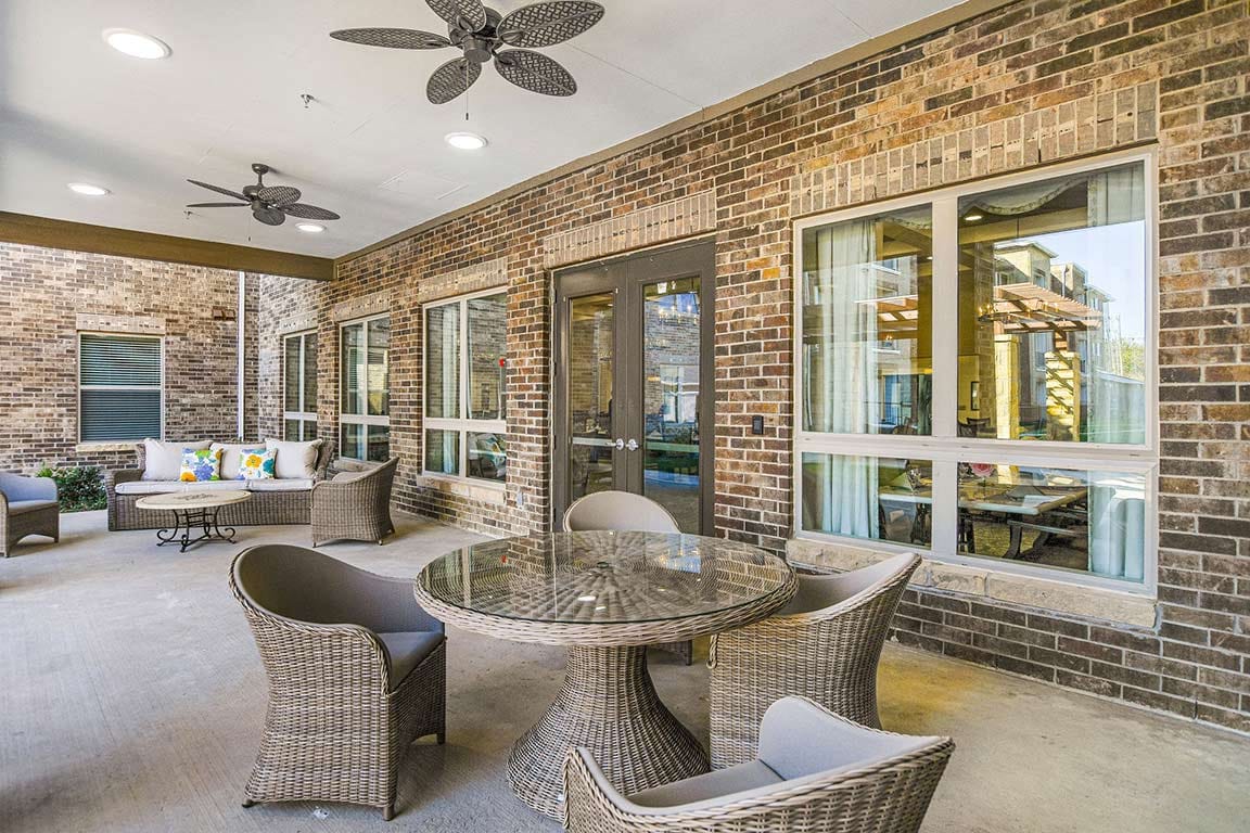 Outdoor seating area with a table and chairs