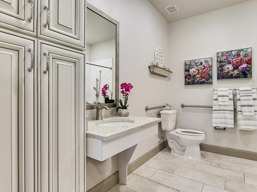 Brightly lit bathroom with floral decor