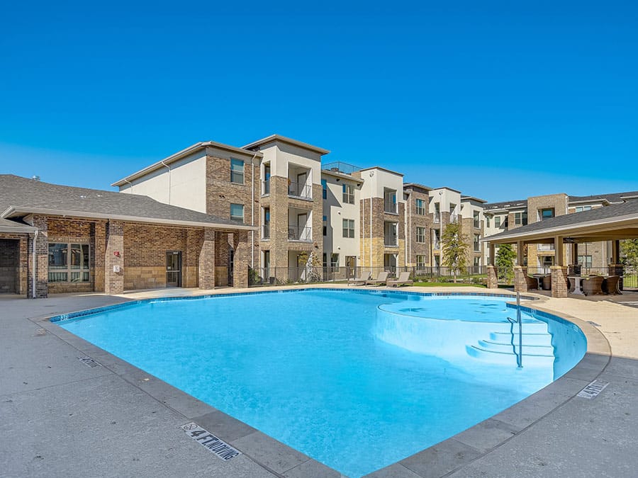 Swimming pool area at Ariel Pointe of Sachse Senior Living