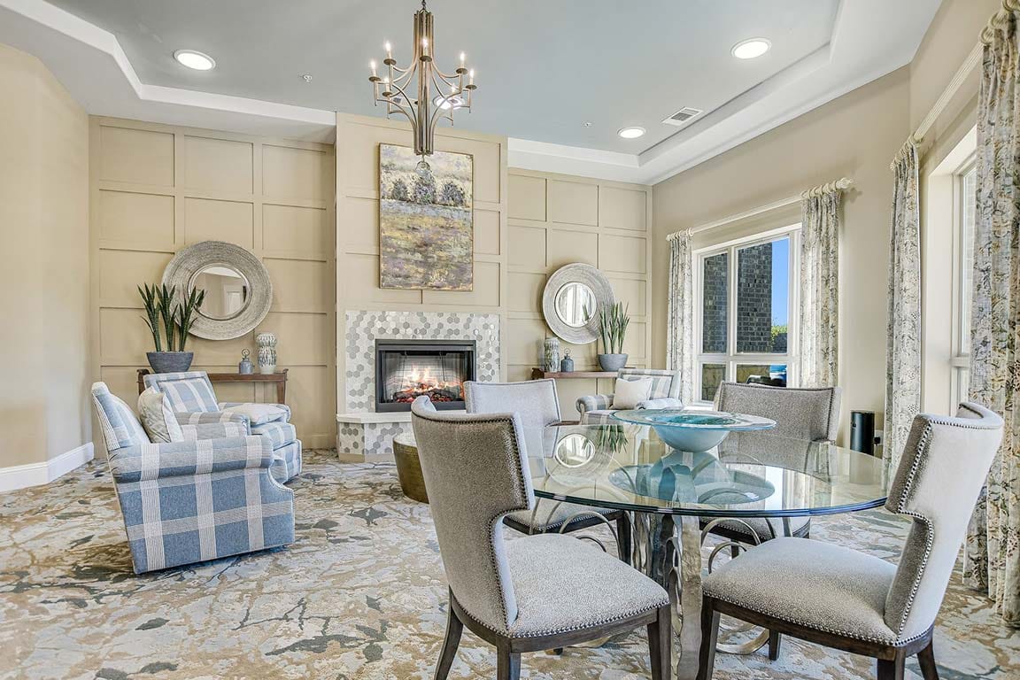A warm and inviting common area with a fireplace