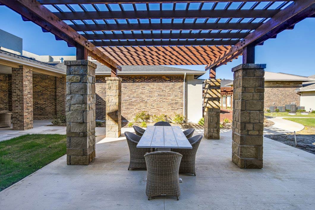 Shaded outdoor patio area with seating