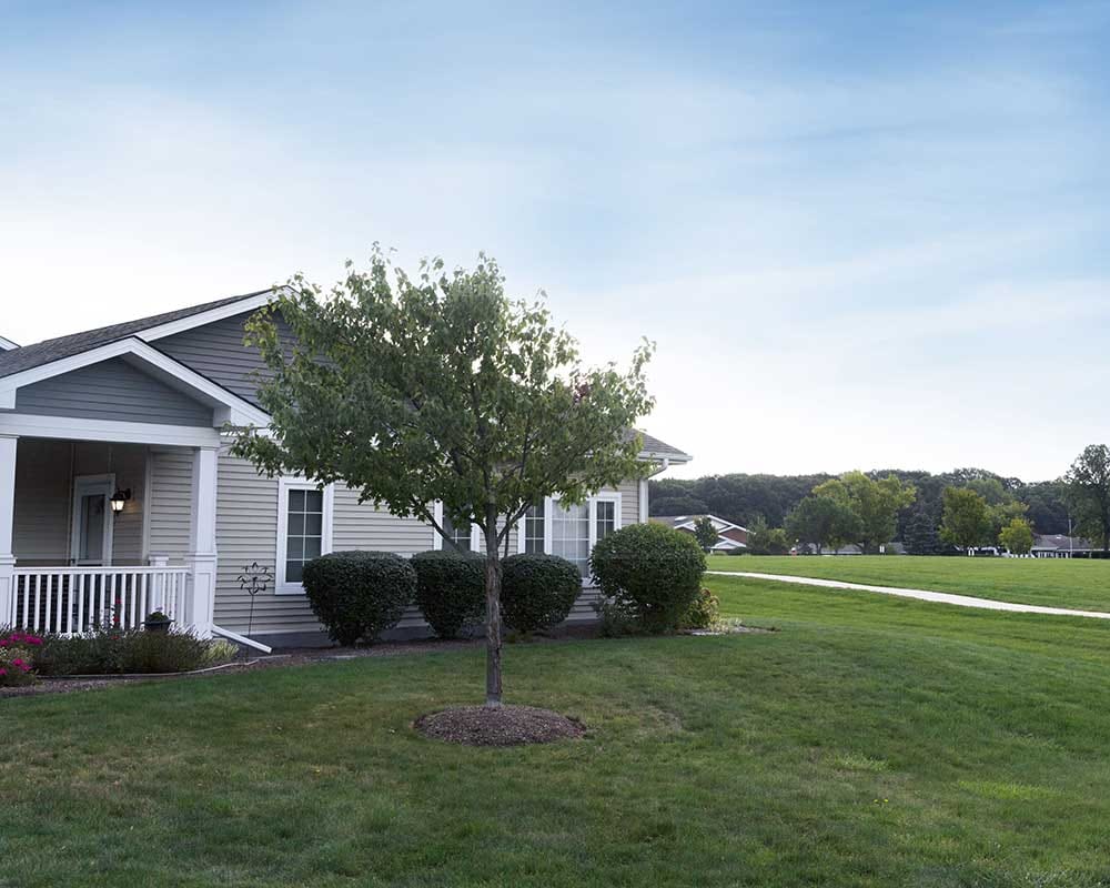 Exterior view of a facility building with landscaped grounds