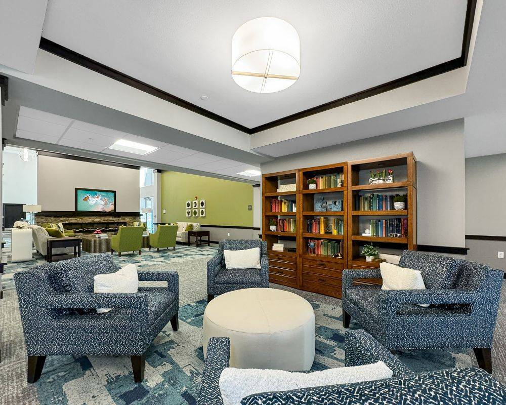 Interior view of a common area with seating and bookshelves
