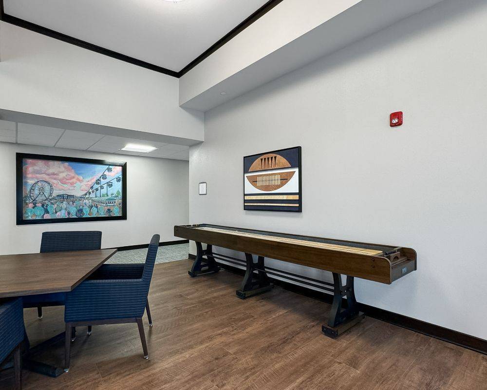 Interior common area with a shuffleboard table