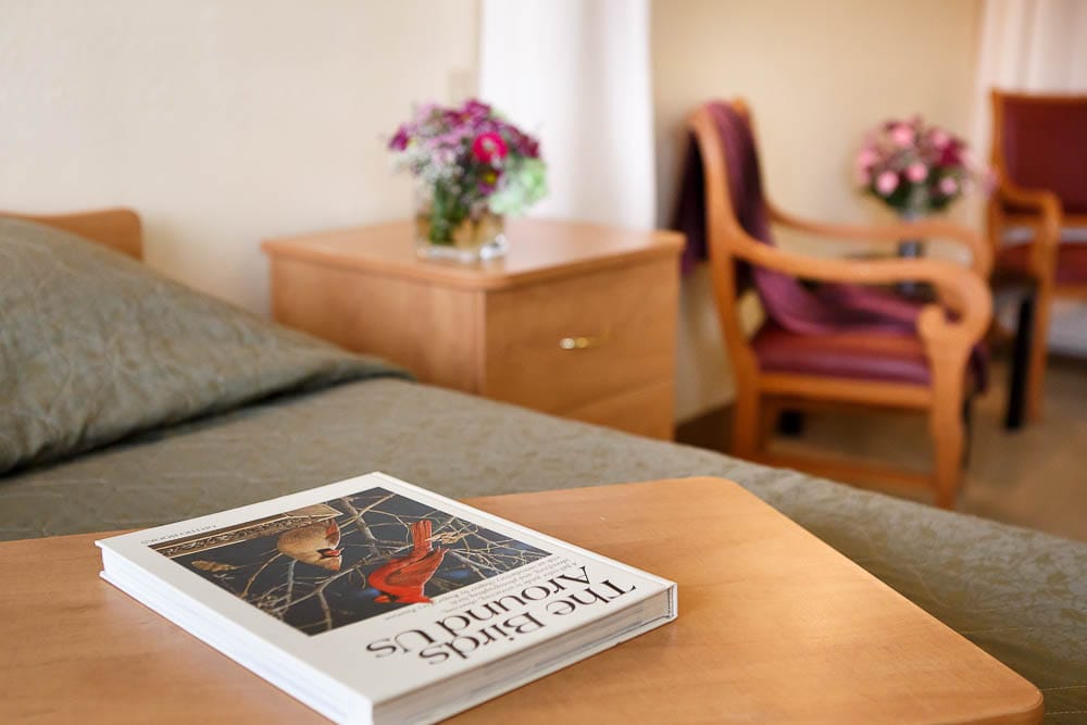 Cozy resident room with book and flowers
