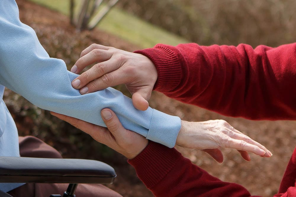 Two hands interacting, showing care and support