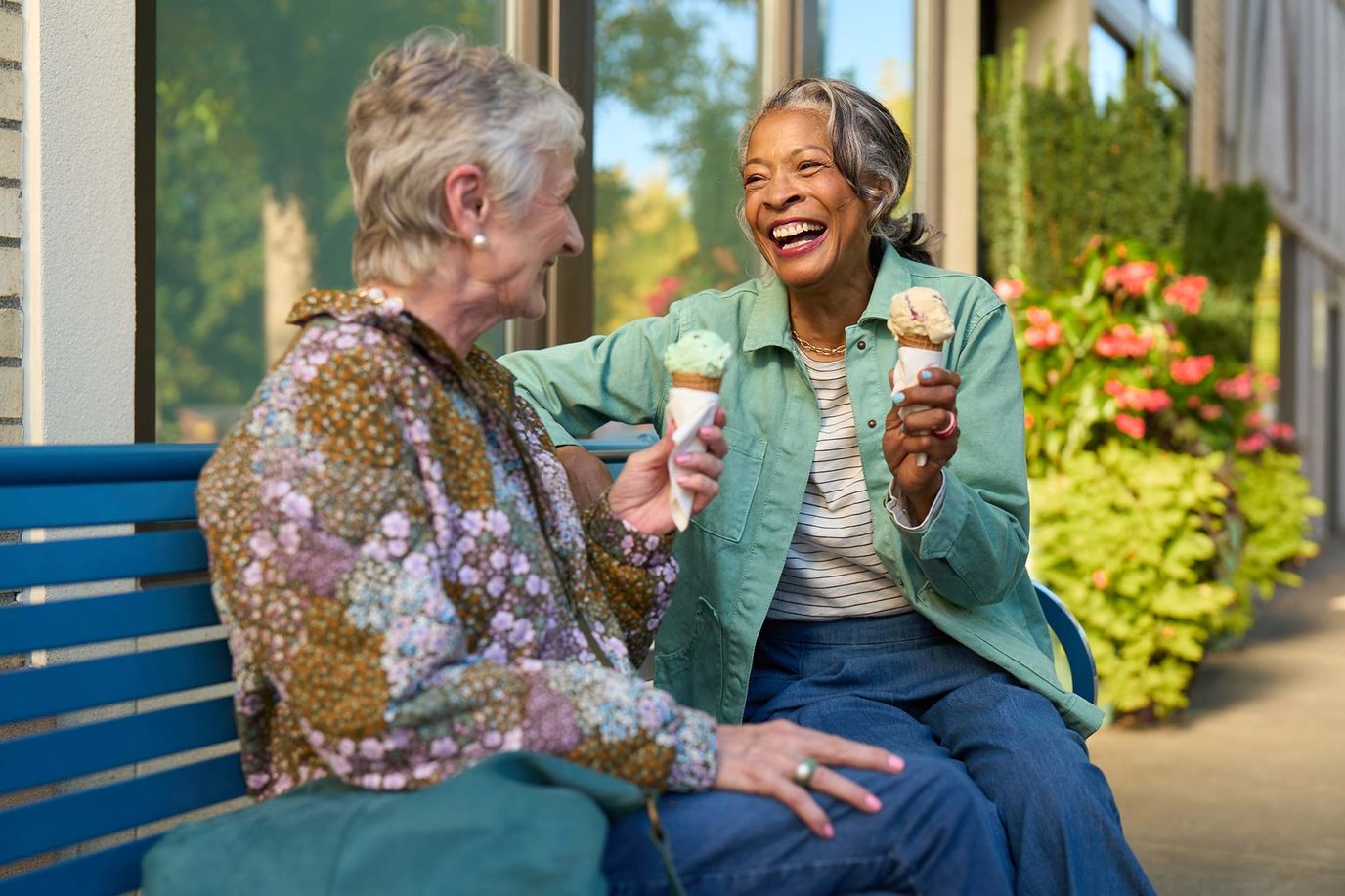 Two residents enjoying ice cream outdoors