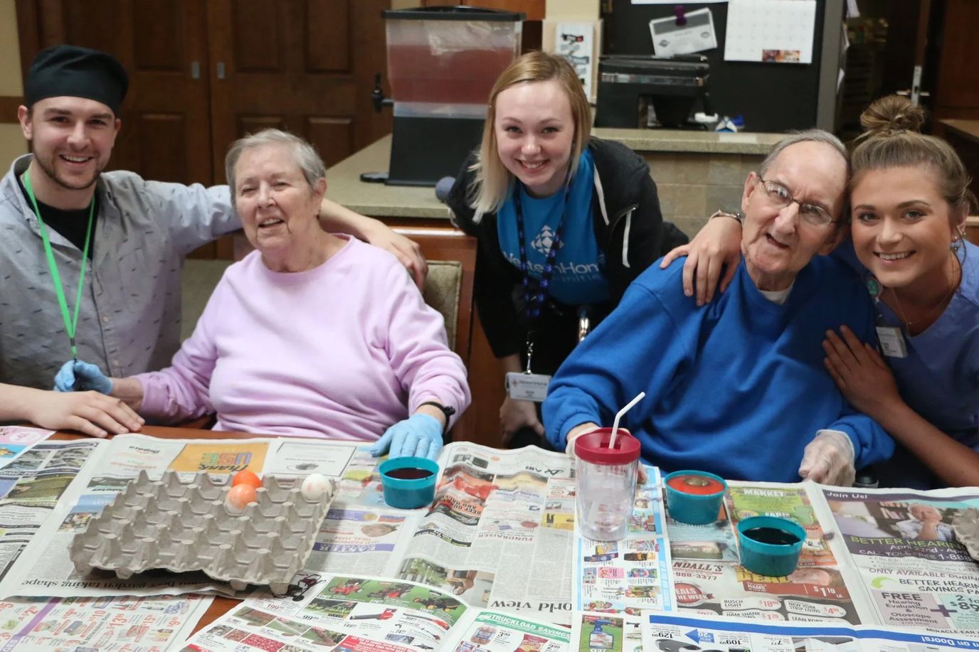 Residents and staff enjoying an activity in a common area