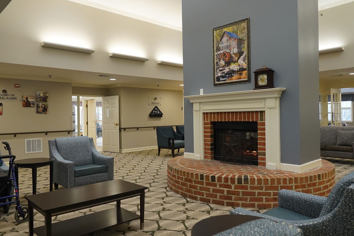 Living room area with fireplace and seating at Celebration Villa of Nittany Valley