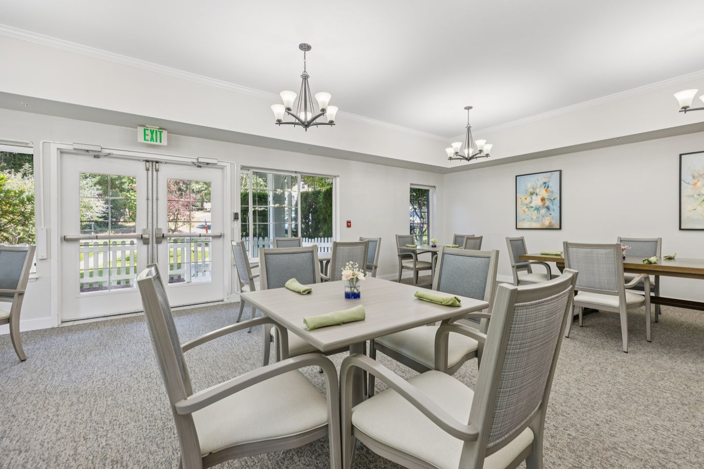 Dining area with tables and chairs in a bright space