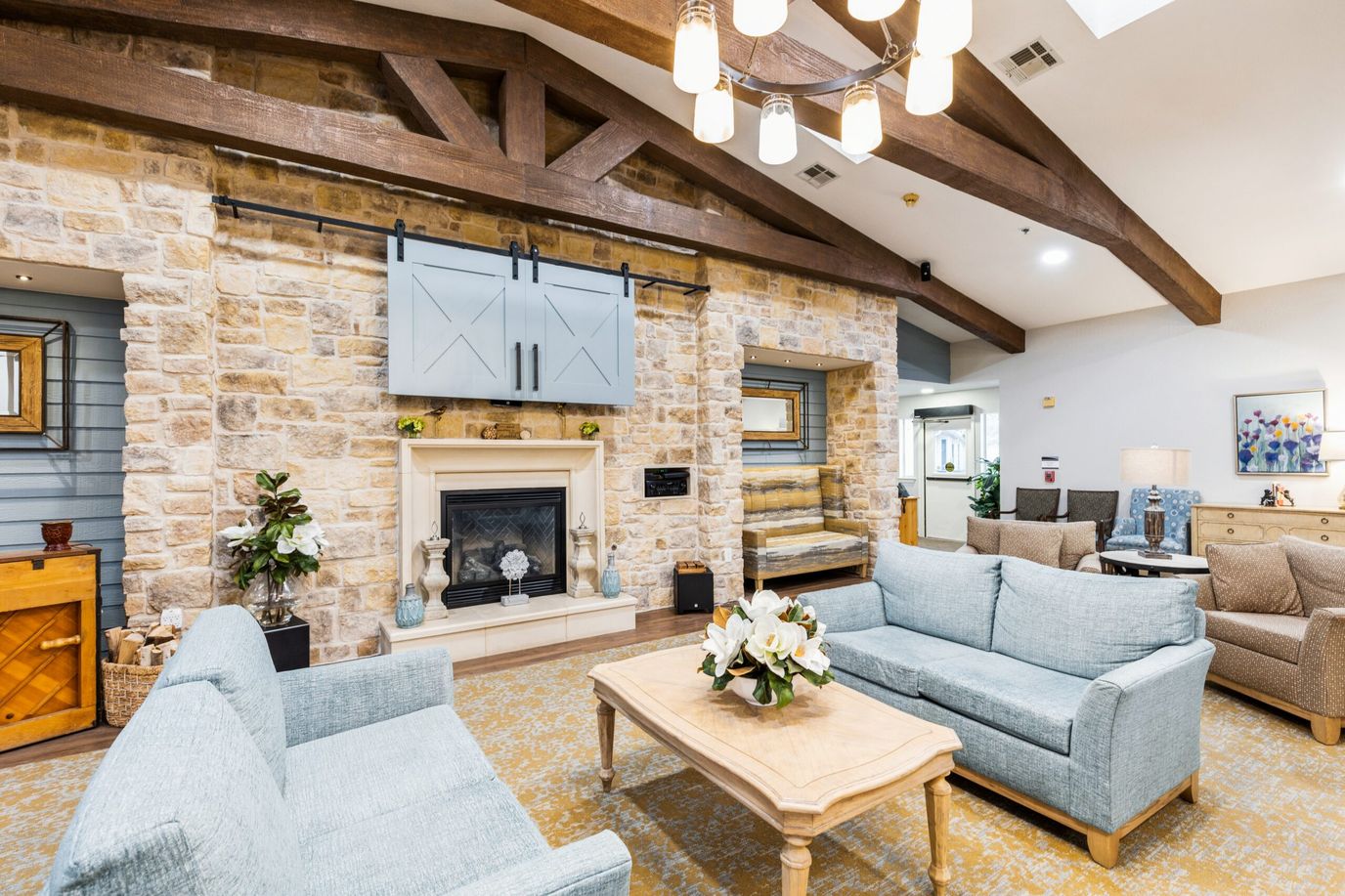 Cozy living room with two sofas and a fireplace