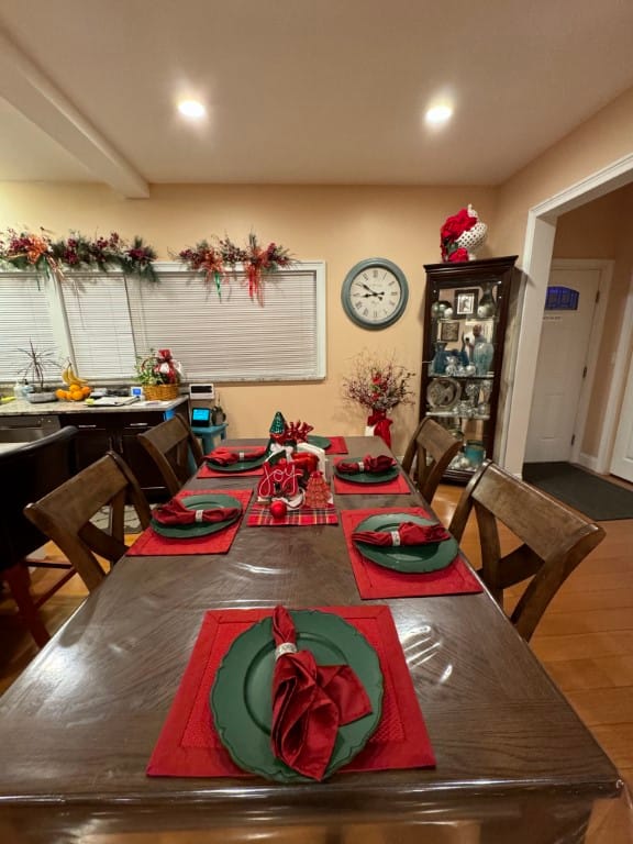 Festively decorated dining table with red and green place settings