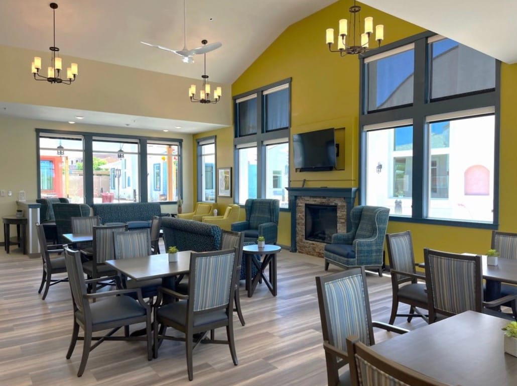 Spacious common area with seating and a fireplace