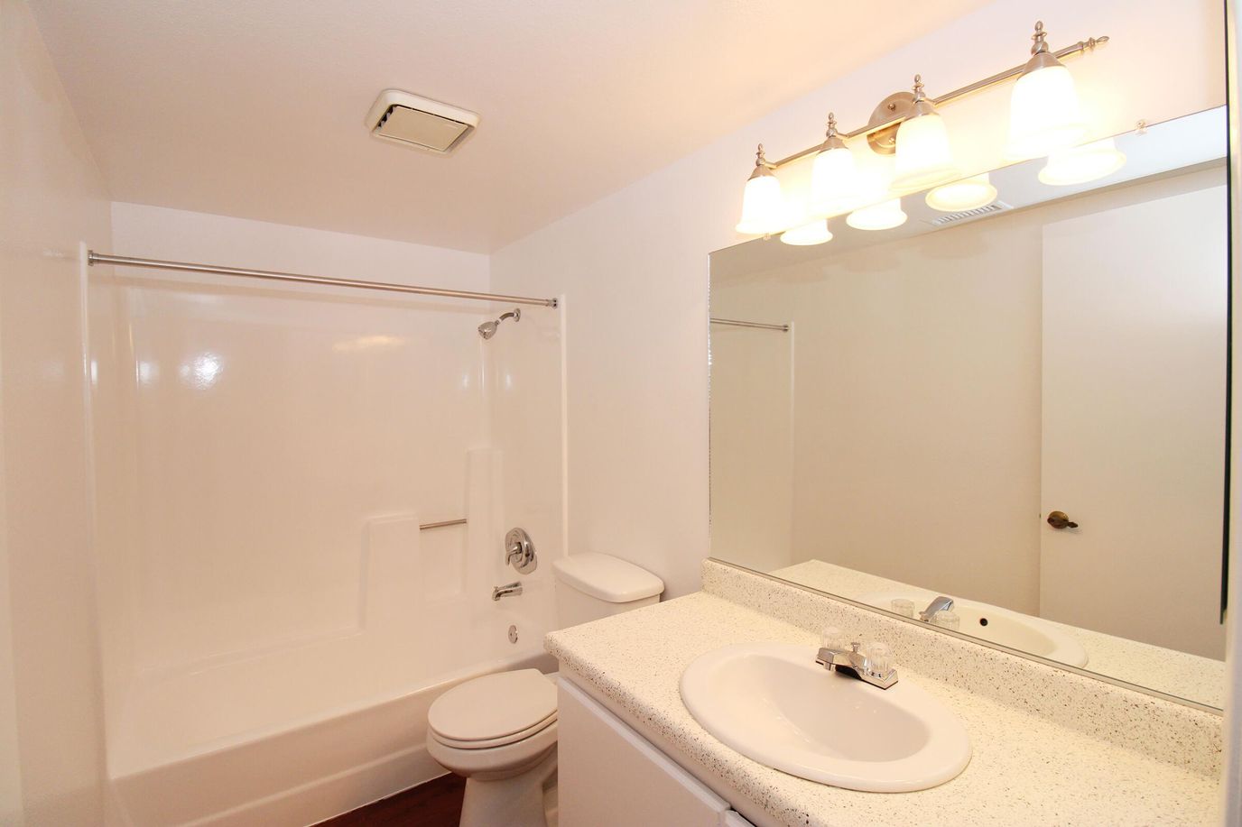 Bright and spacious bathroom with shower and sink