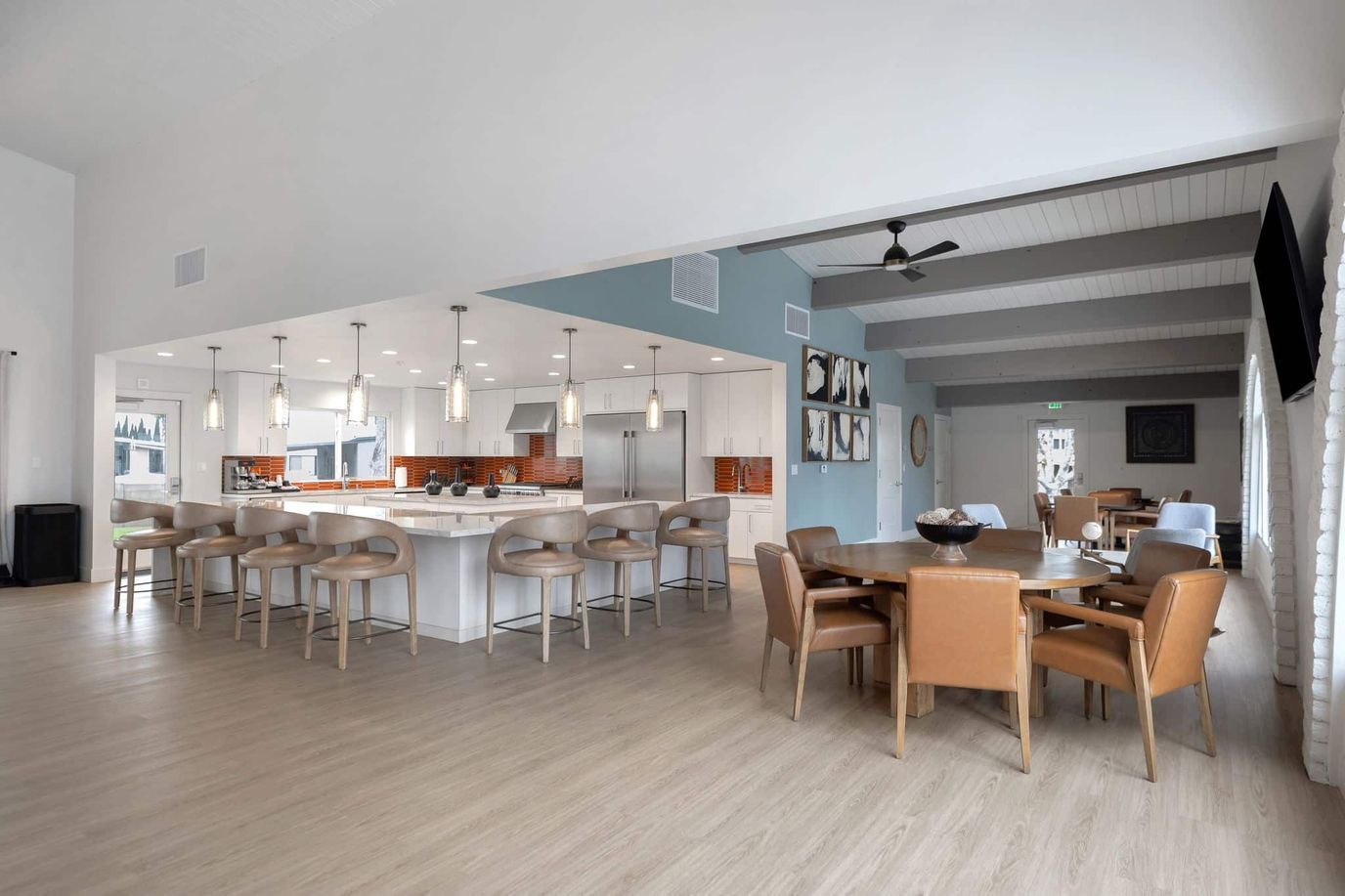 Bright, spacious common area with dining setup