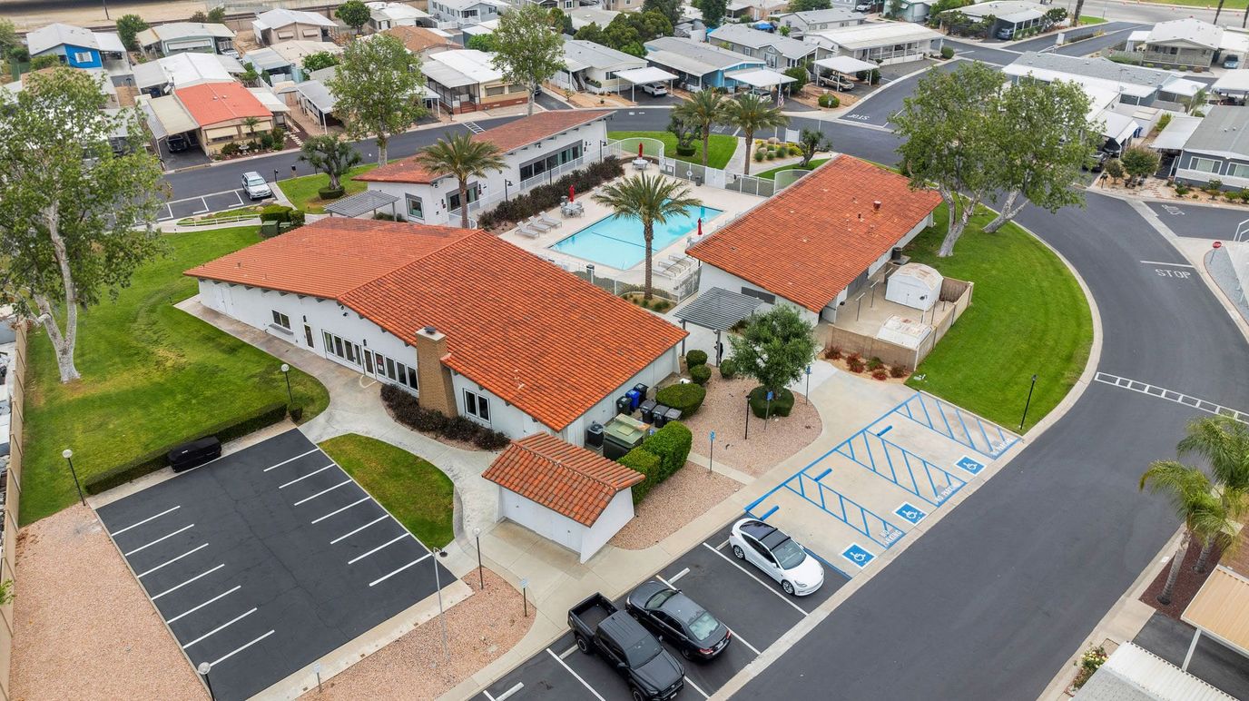 Aerial view of a senior living facility with a pool