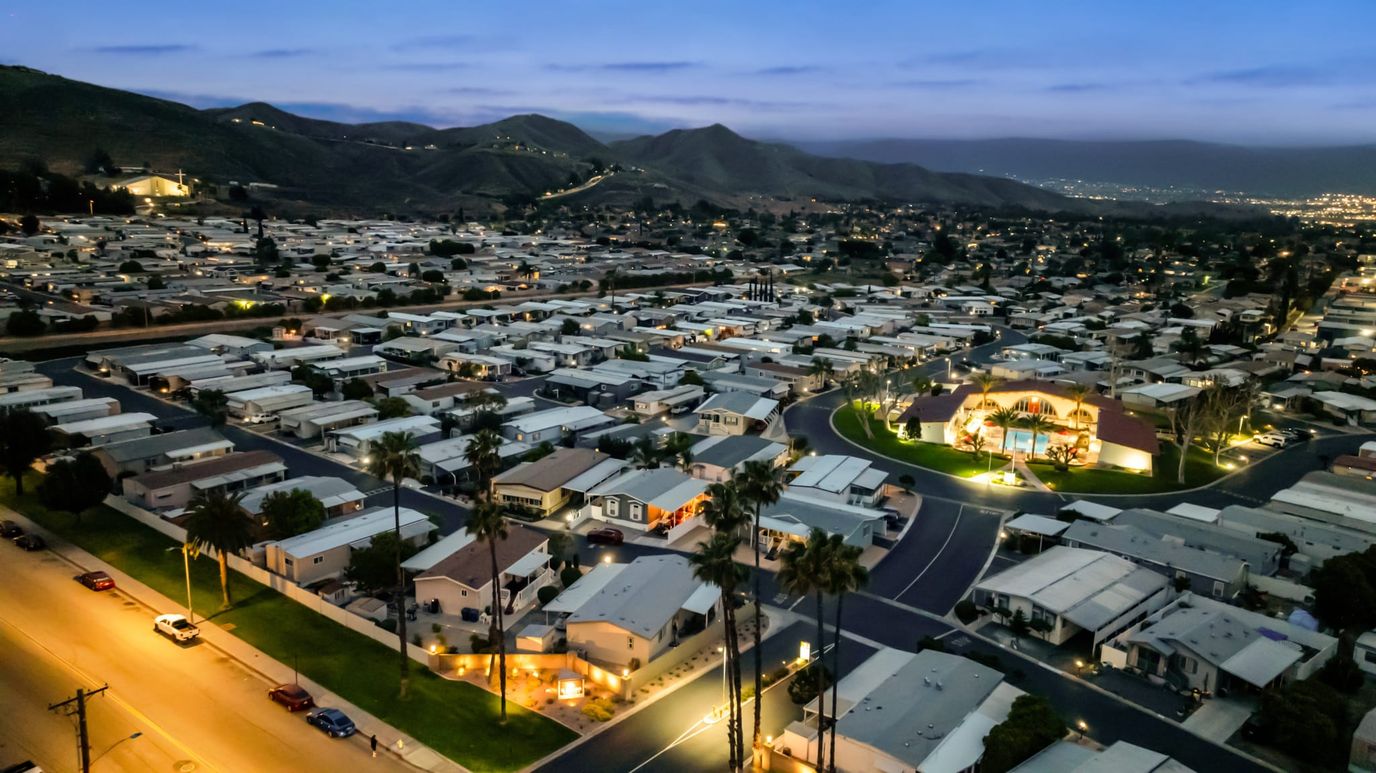 Aerial view of a senior living community at dusk