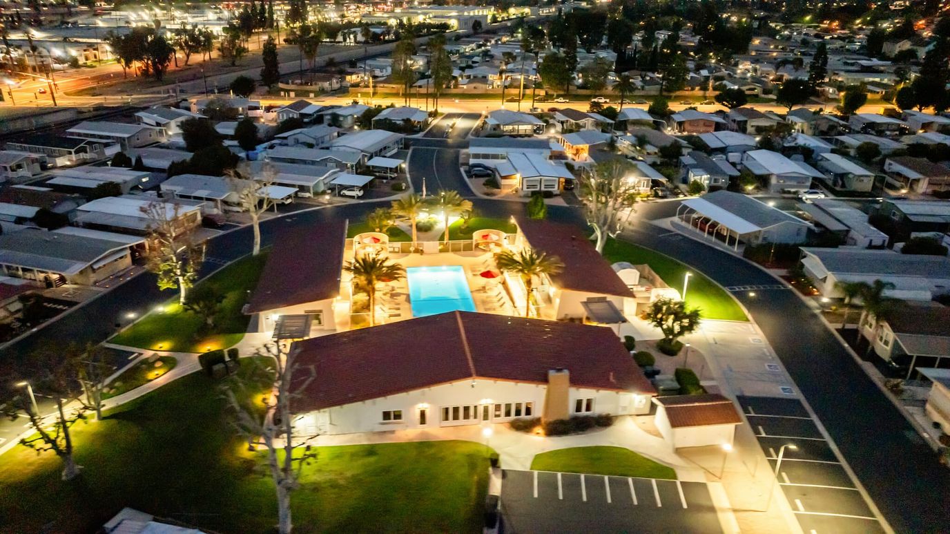 Aerial view of a senior living facility with a pool