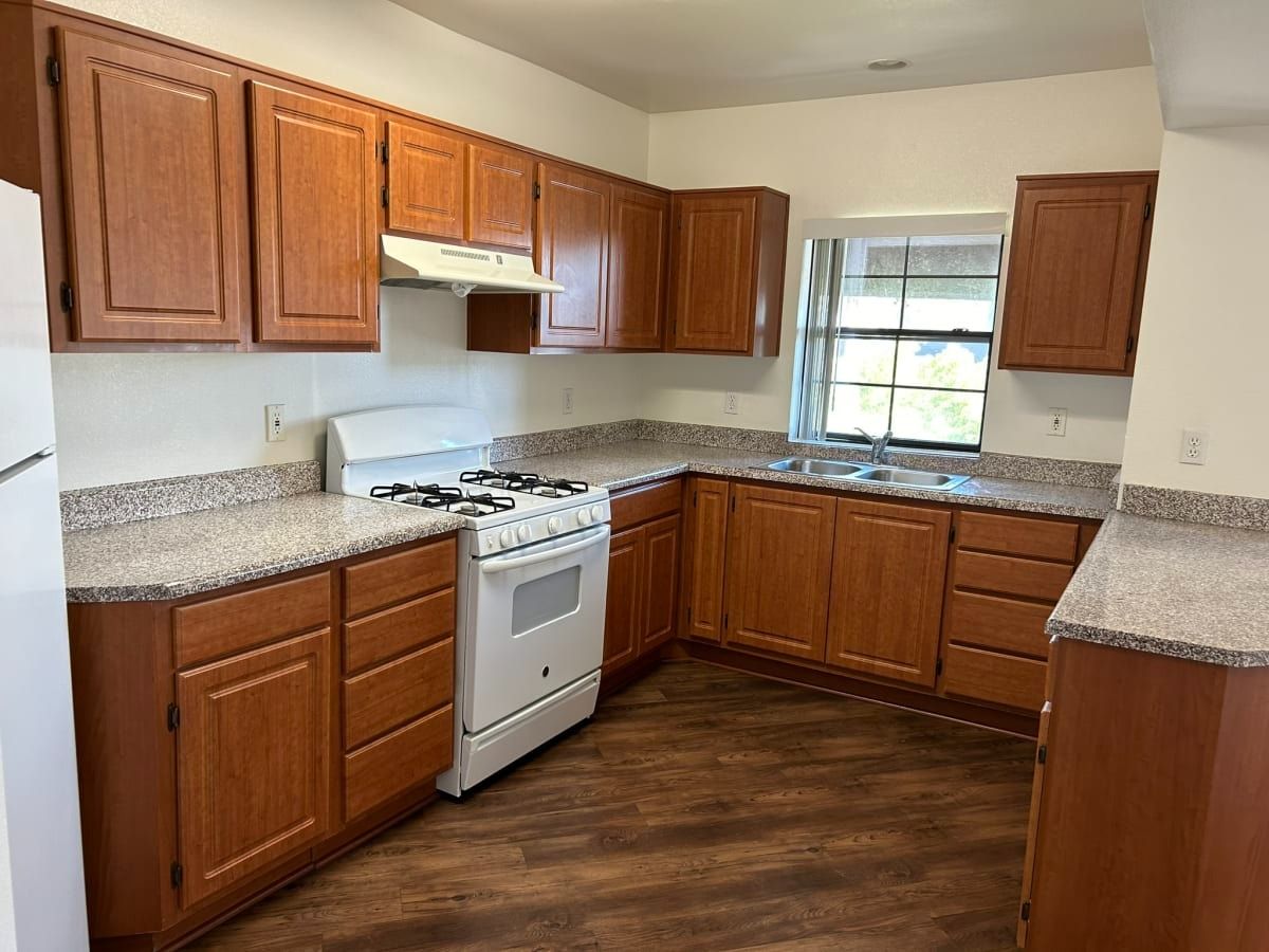 Kitchen with wooden cabinets and granite countertops