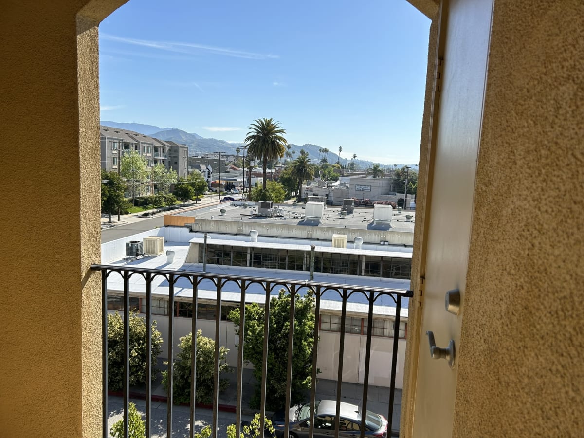 Balcony view overlooking a cityscape and mountains in Glendale, CA