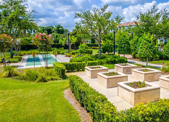 Beautiful landscaped garden area with seating and pool