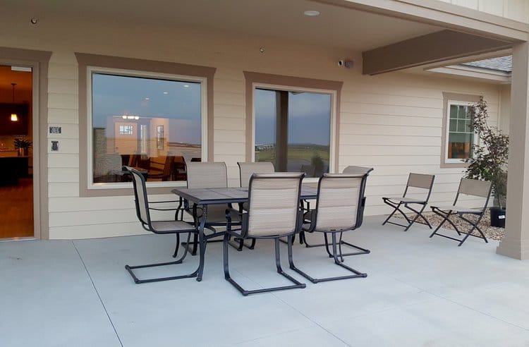 Patio area with seating at The Cottages Senior Care Living