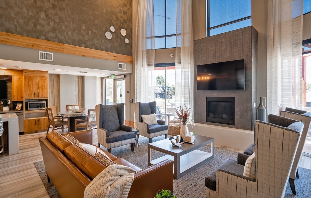 Spacious lobby area with seating and fireplace