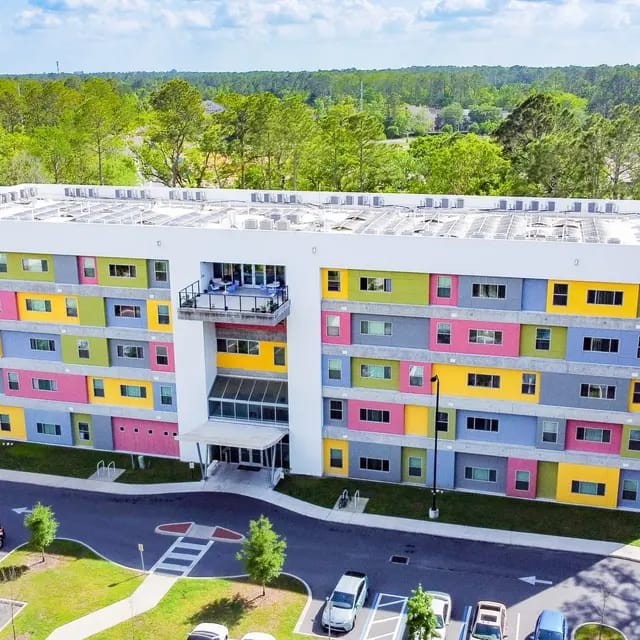 Aerial view of the colorful Deer Creek Senior Housing building