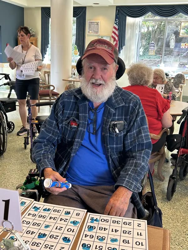 Resident playing bingo in a common area