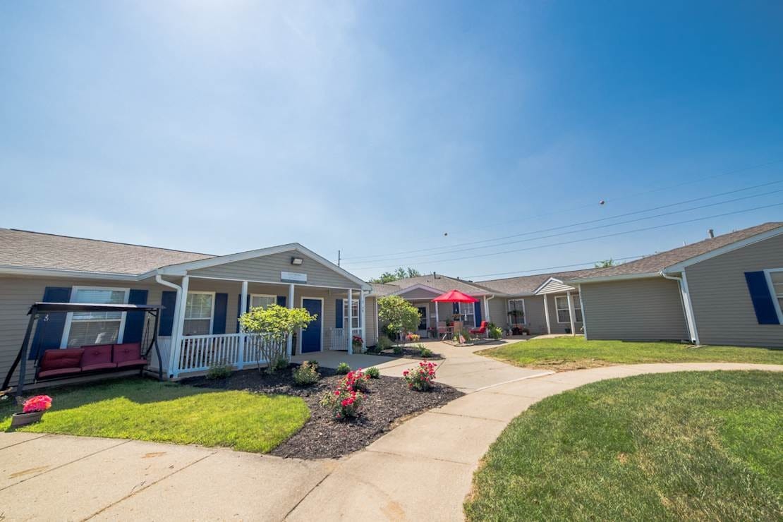 View of the Cottages of Anderson with flower beds and walking paths