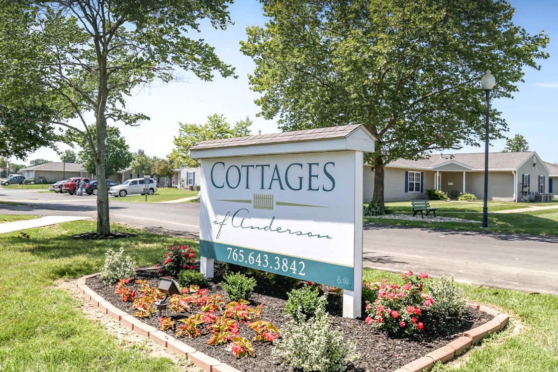 Signage for Cottages of Anderson with landscaped flowers