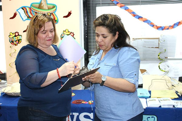 Two staff members collaborating at a table