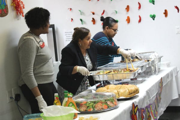Staff serving food at a community event