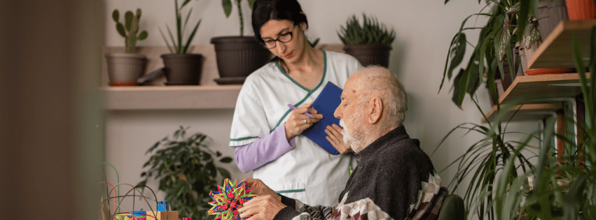 Staff assisting a resident with activities.