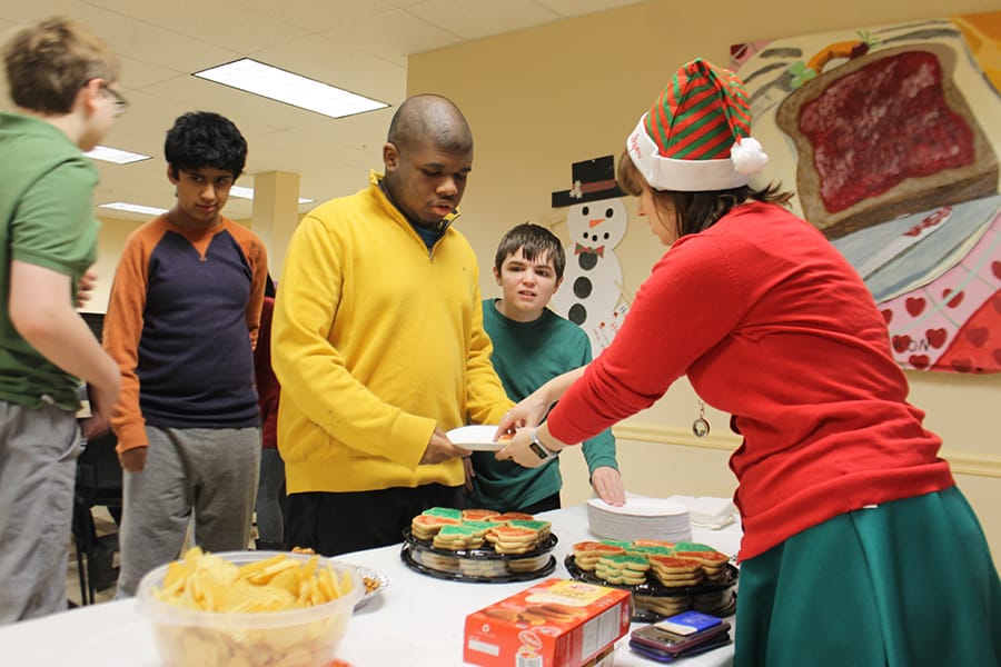 Residents participating in an activity with snacks.