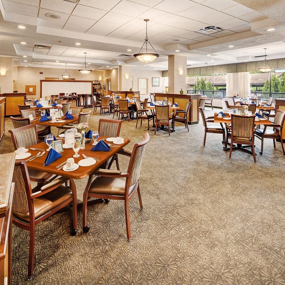 Dining room setup with tables and chairs