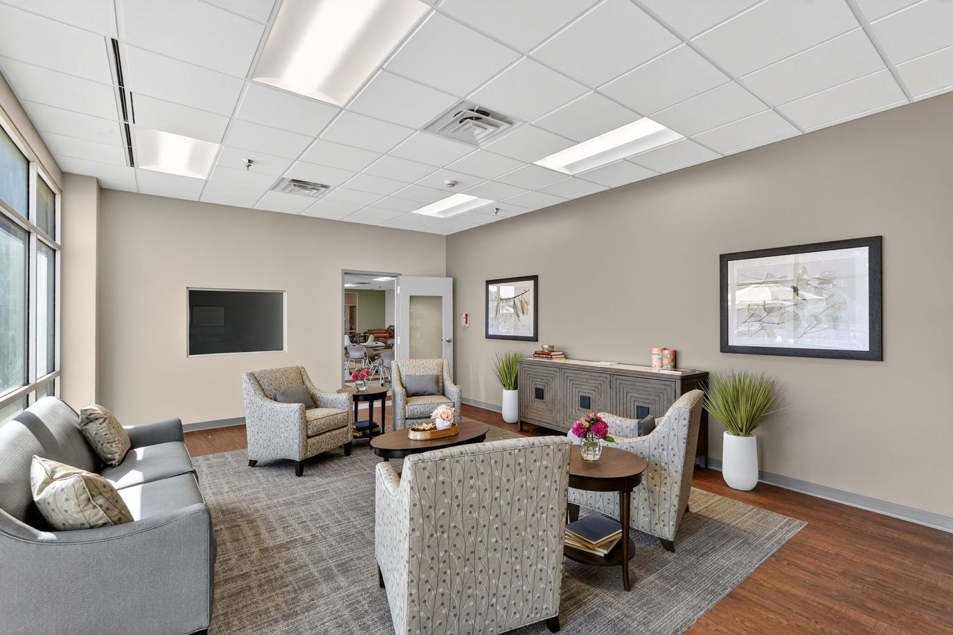 Bright common area with seating and plants