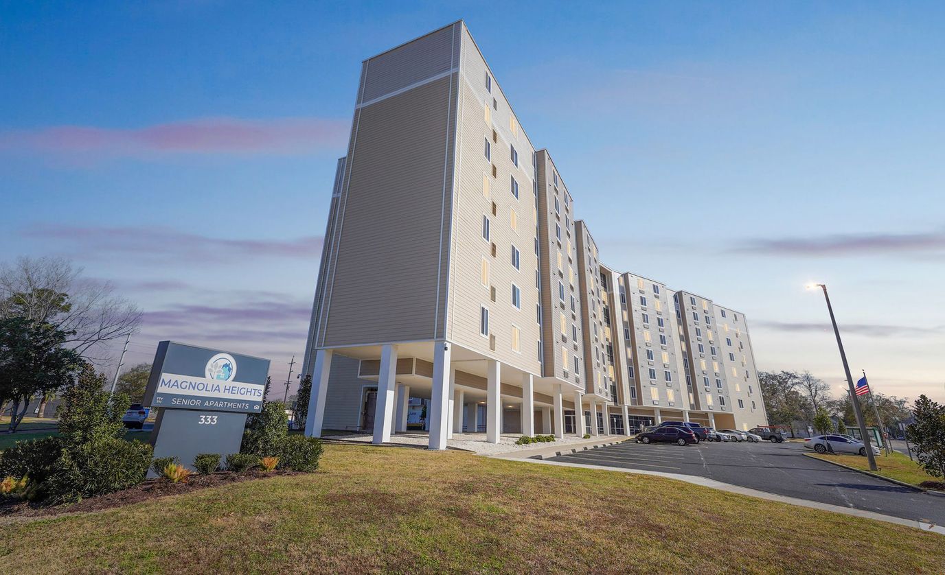 Exterior view of Magnolia Heights building with landscaped area