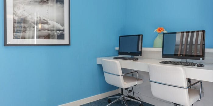 Interior office space with computers and decor.