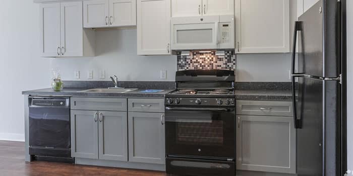 Modern kitchen area with appliances.