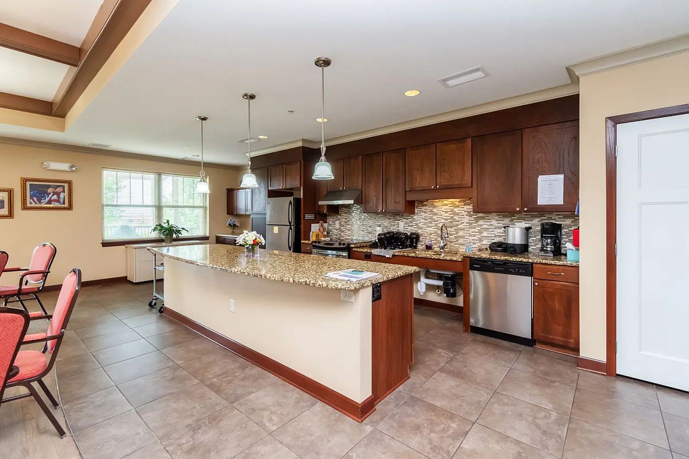 Modern kitchen with granite countertops and stainless steel appliances.