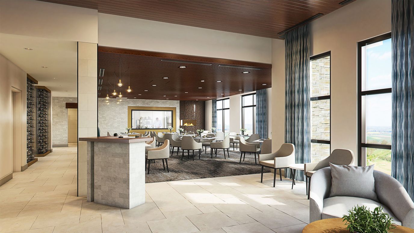 Bright dining area with modern furniture and large windows