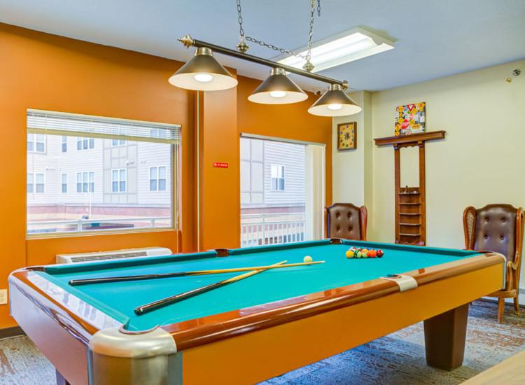 Interior view of a game room with a pool table