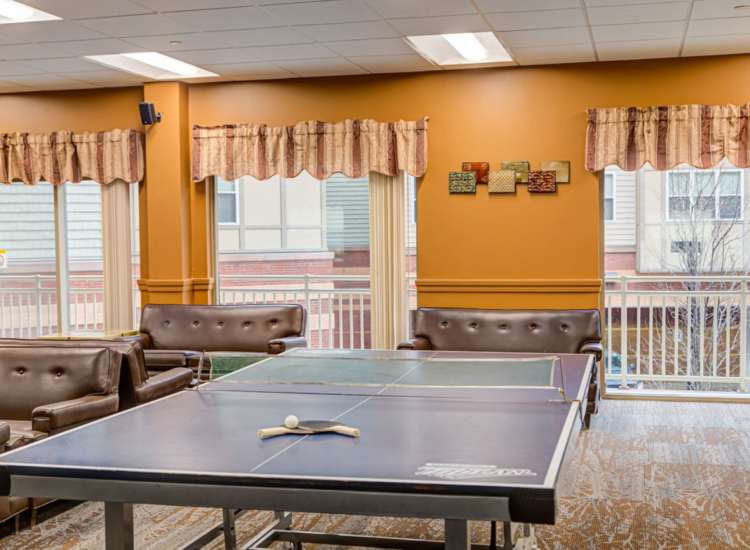 Indoor common area with ping pong table and seating