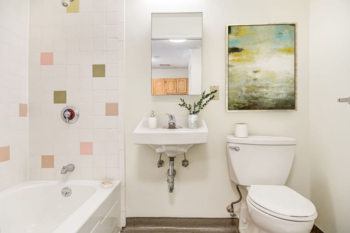 Bright and clean bathroom with tub and sink